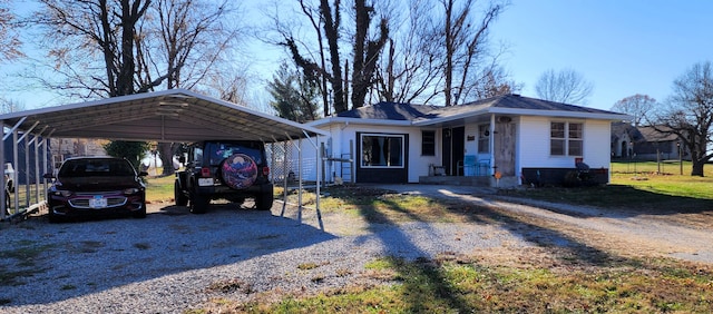 ranch-style house featuring a carport