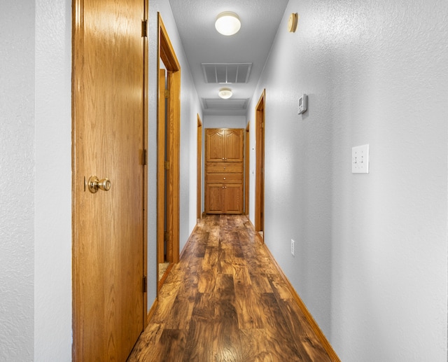 hallway featuring dark wood-type flooring