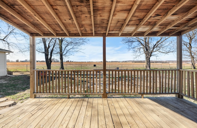 wooden deck featuring a rural view