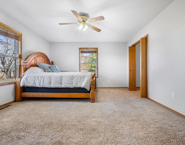 carpeted bedroom with ceiling fan