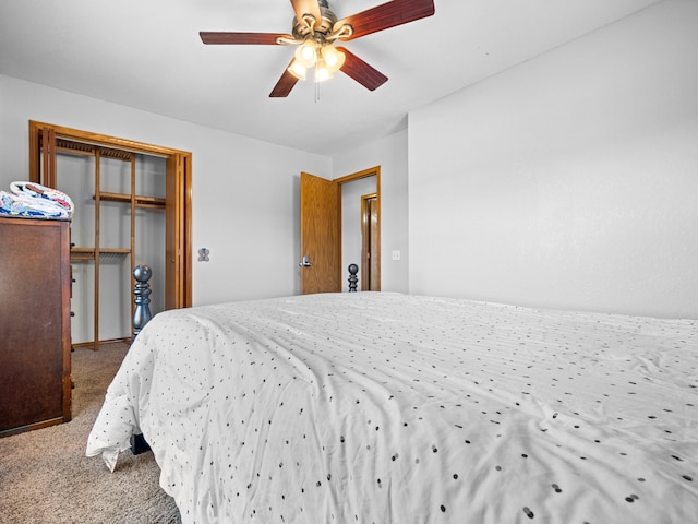 carpeted bedroom with a closet and ceiling fan