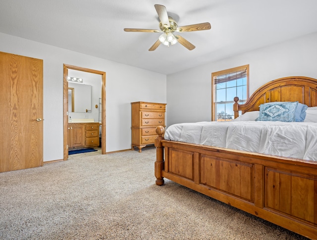 bedroom with light carpet, connected bathroom, and ceiling fan