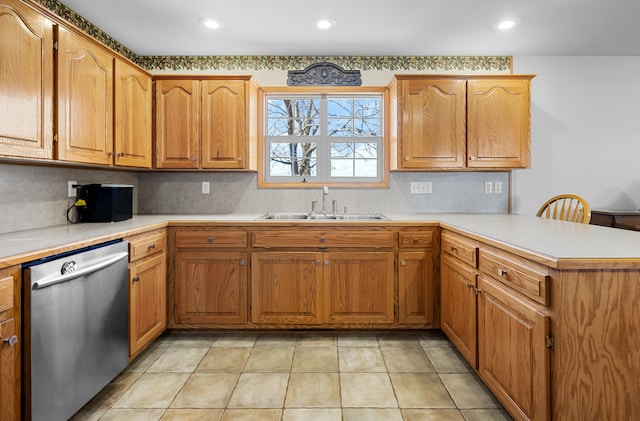 kitchen featuring kitchen peninsula, backsplash, sink, light tile patterned floors, and dishwasher