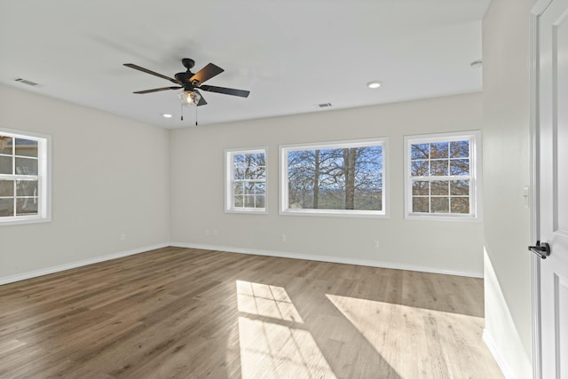 unfurnished room featuring ceiling fan and light wood-type flooring