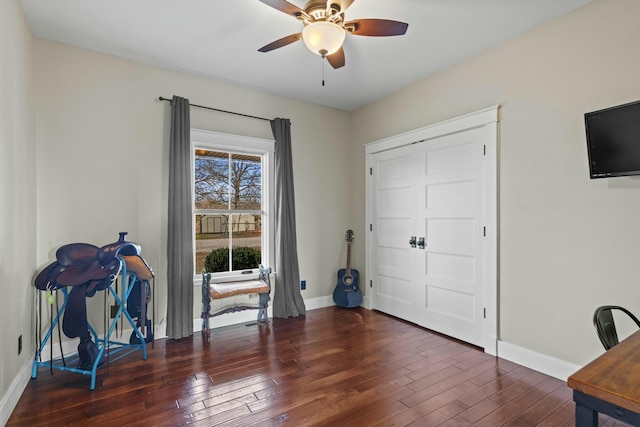 office with ceiling fan and dark wood-type flooring