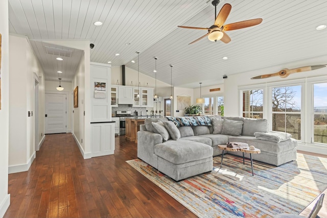 living room with ceiling fan, dark hardwood / wood-style flooring, wood ceiling, and vaulted ceiling