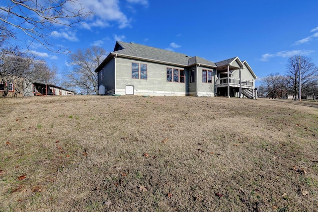 rear view of house with a lawn