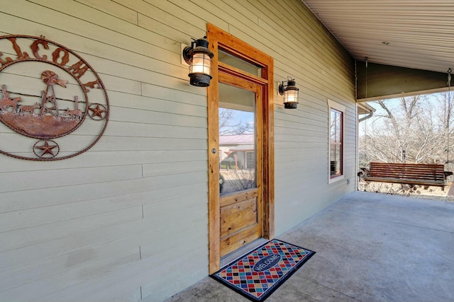 doorway to property with covered porch