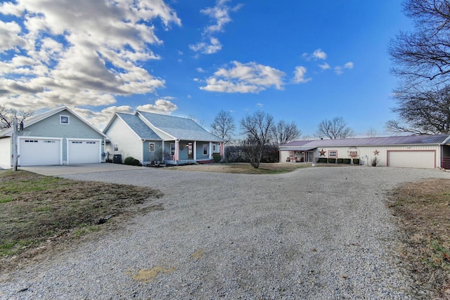 ranch-style house with a porch and a garage