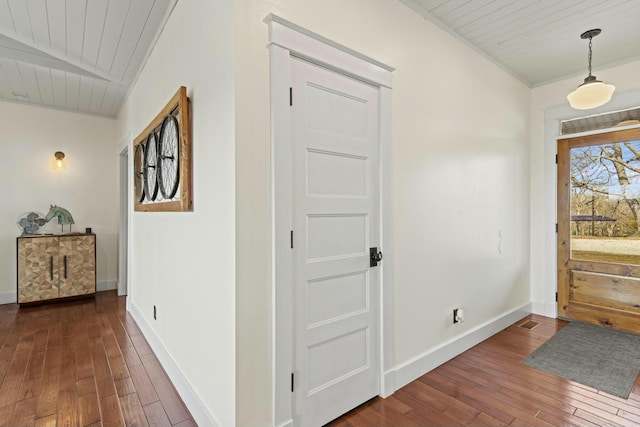 entrance foyer featuring wood ceiling and dark hardwood / wood-style floors