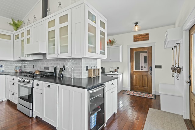 kitchen featuring gas range, white cabinetry, beverage cooler, dark hardwood / wood-style flooring, and custom range hood