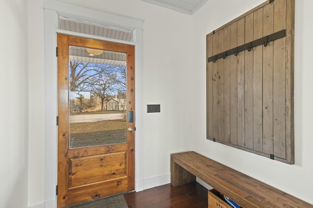 interior space featuring dark hardwood / wood-style floors and ornamental molding