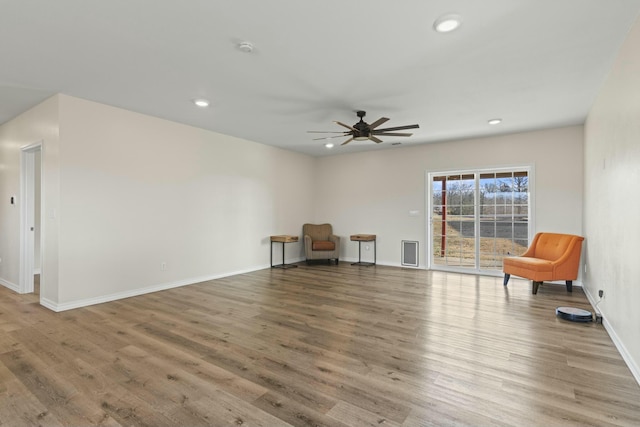 unfurnished room featuring hardwood / wood-style flooring and ceiling fan