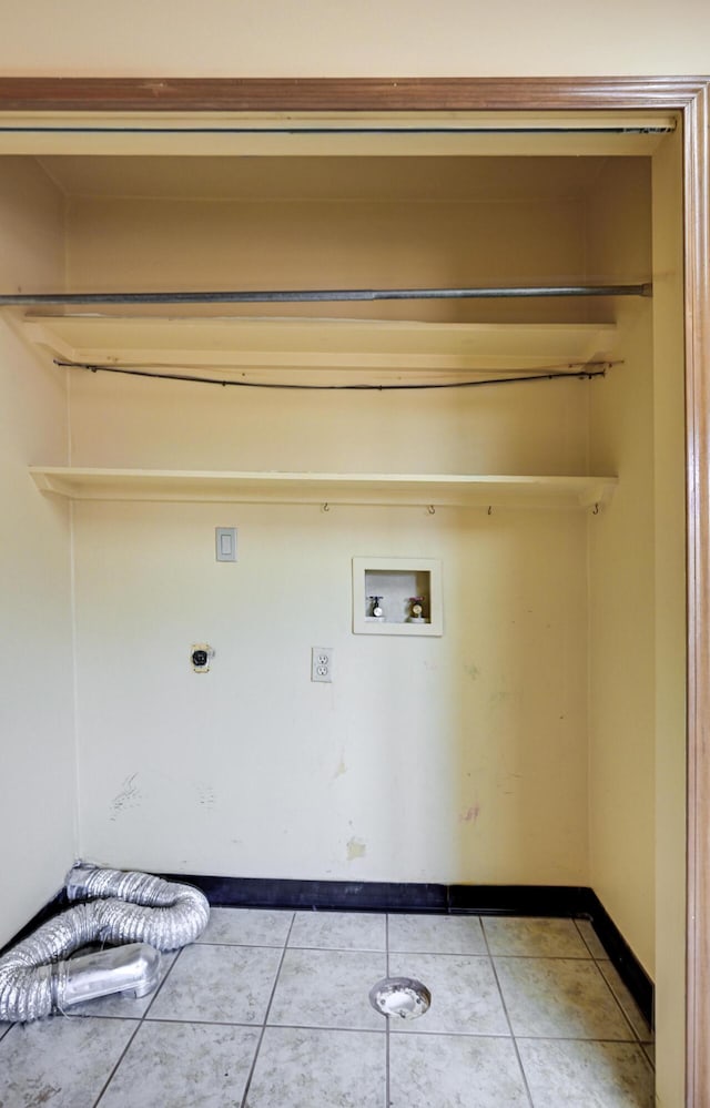 washroom with light tile patterned flooring and hookup for an electric dryer