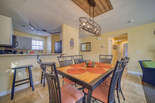 dining space with a chandelier