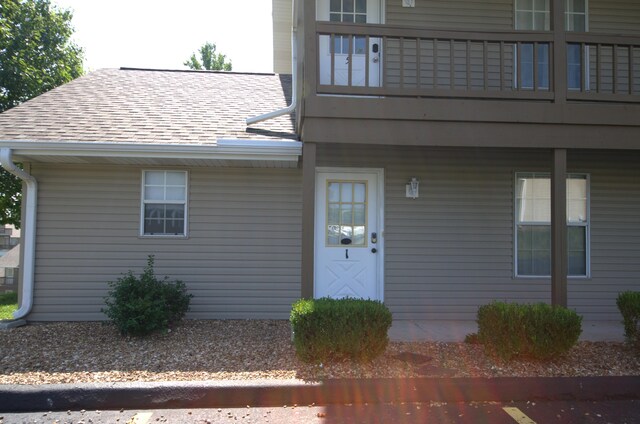 doorway to property featuring a balcony