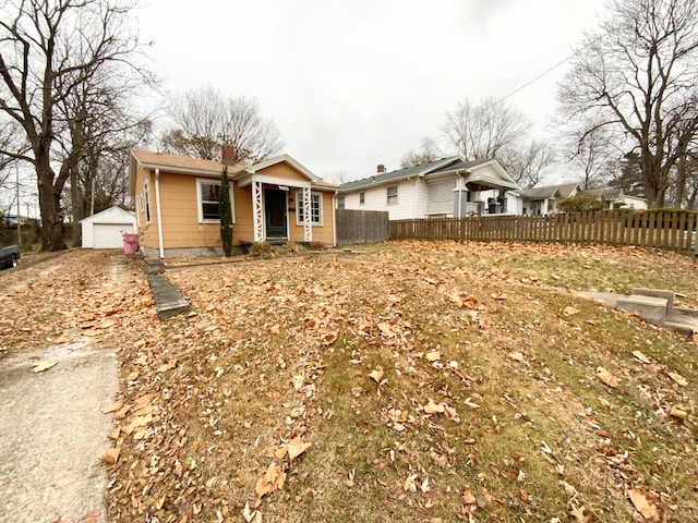 ranch-style house with an outbuilding and a garage