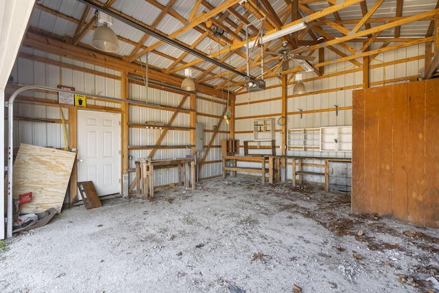 garage with electric panel and a garage door opener