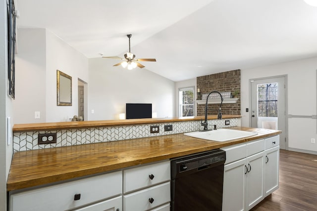 kitchen featuring dishwasher, wood counters, a healthy amount of sunlight, and sink