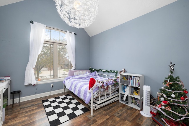 bedroom featuring dark hardwood / wood-style floors, vaulted ceiling, a chandelier, and multiple windows