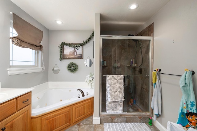 bathroom with vanity and plus walk in shower