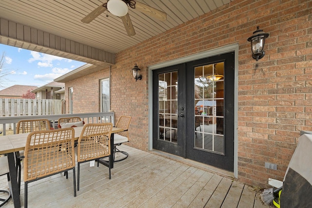 view of patio with french doors, a deck, and ceiling fan