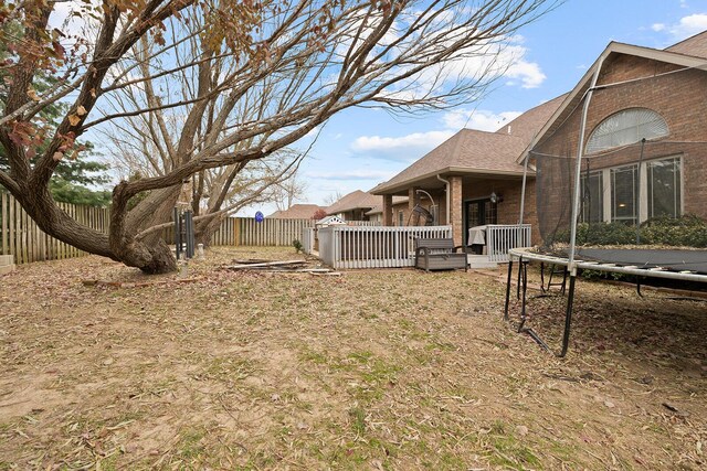 view of yard with a trampoline