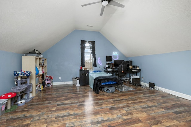 home office with a textured ceiling, dark hardwood / wood-style flooring, ceiling fan, and lofted ceiling