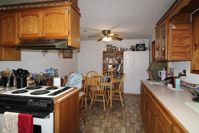 kitchen featuring white range with electric cooktop and ceiling fan