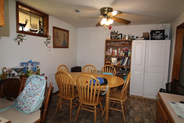 dining area with ceiling fan