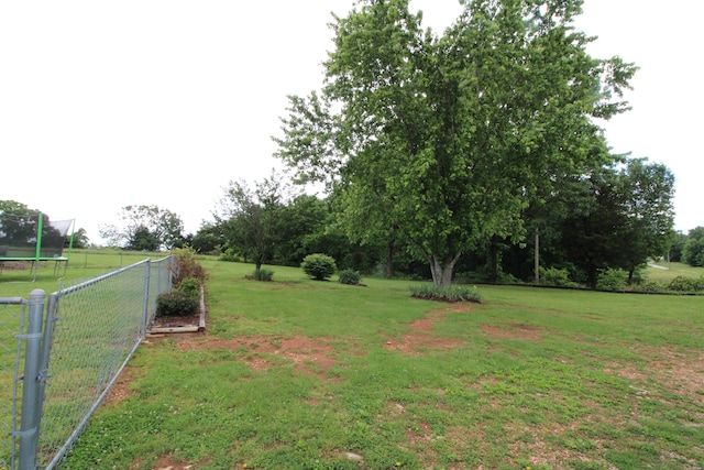 view of yard featuring a trampoline