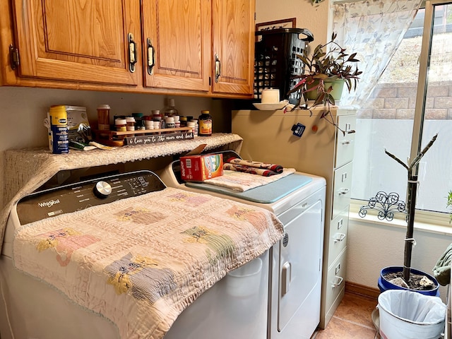 180 Wilshire Dr Unit 88, Hollister, MO 65672 - laundry area featuring independent washer and dryer, cabinet space, and light tile patterned floors