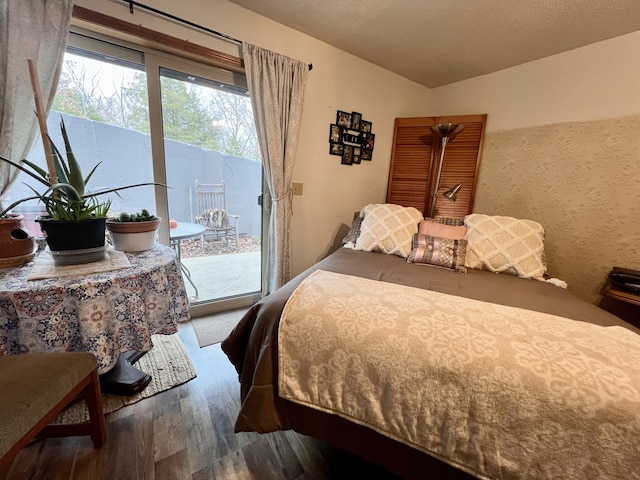 180 Wilshire Dr Unit 88, Hollister, MO 65672 - bedroom with wood finished floors and access to exterior