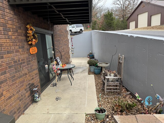 180 Wilshire Dr Unit 88, Hollister, MO 65672 - view of patio featuring a garage
