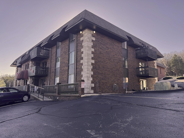 view of outdoor building at dusk