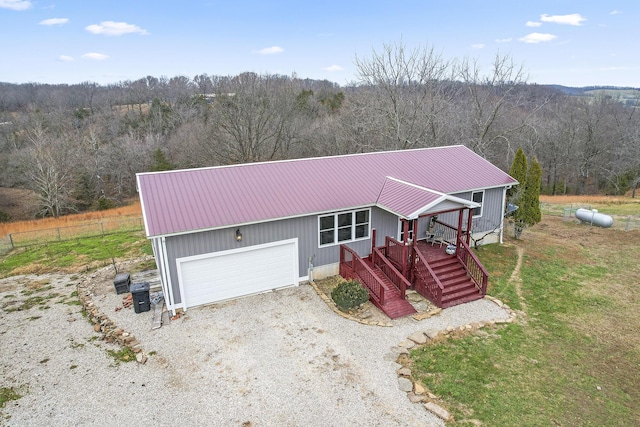 view of front of home with covered porch and a garage