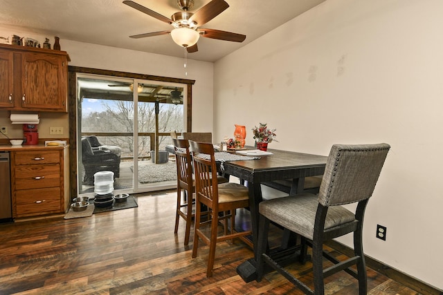 dining space with ceiling fan and dark hardwood / wood-style flooring