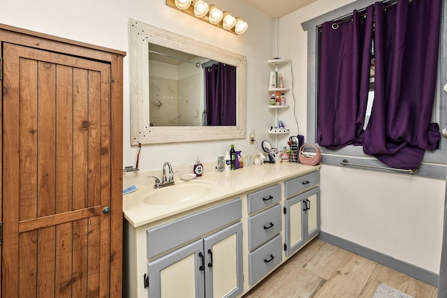 bathroom featuring hardwood / wood-style floors and vanity