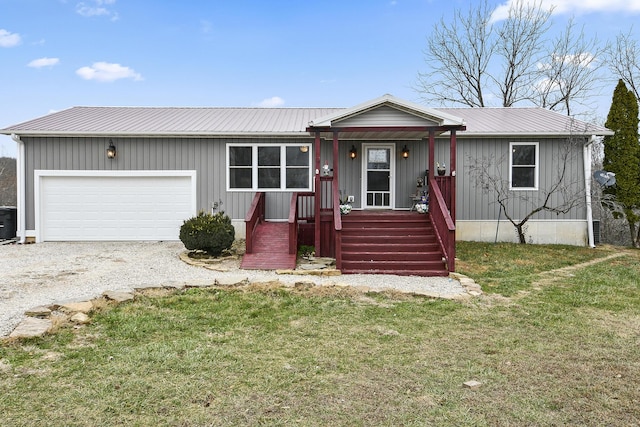 view of front facade with a front yard and a garage