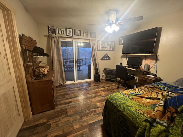 bedroom with access to exterior, dark hardwood / wood-style flooring, and ceiling fan