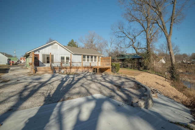 213 Mill St, Anderson, MO 64831 - view of front facade with board and batten siding