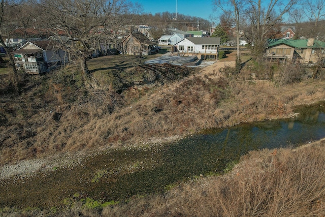 213 Mill St, Anderson, MO 64831 - aerial perspective of suburban area