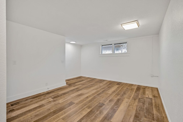 213 Mill St, Anderson, MO 64831 - basement with wood finished floors and baseboards