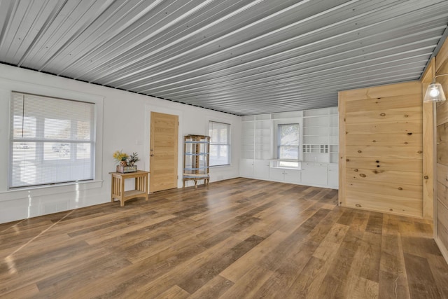 213 Mill St, Anderson, MO 64831 - living area featuring wood finished floors, wooden ceiling, and built in features
