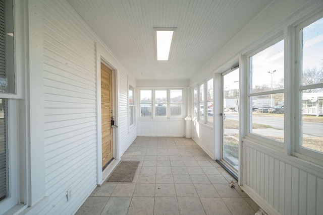 213 Mill St, Anderson, MO 64831 - unfurnished sunroom with radiator heating unit