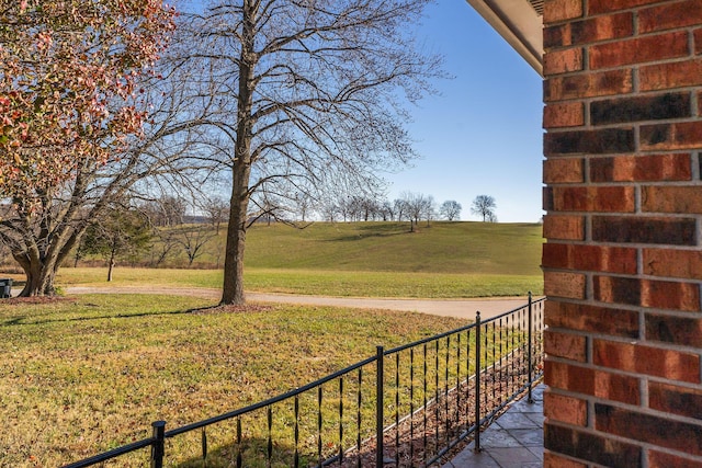 view of yard with a rural view