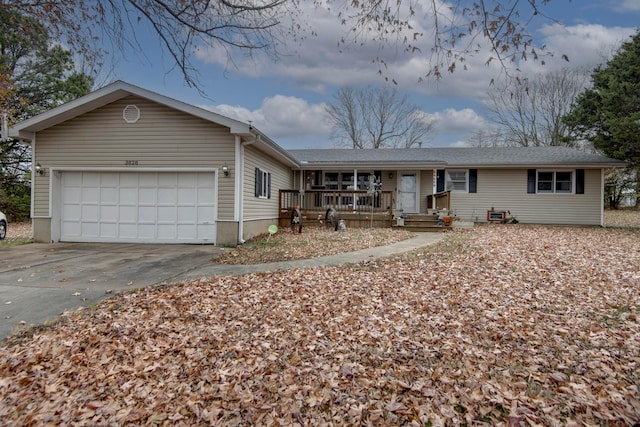 ranch-style home featuring a garage