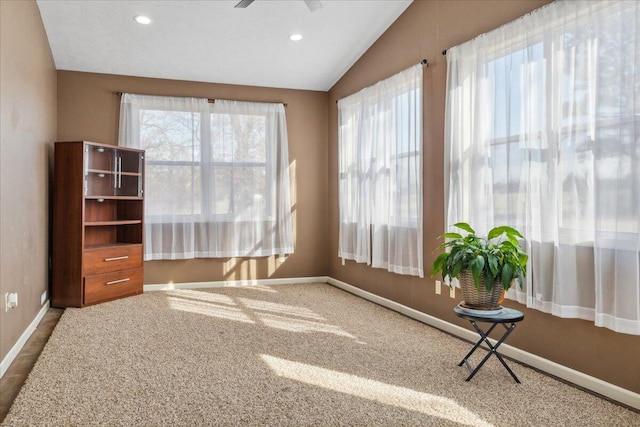 unfurnished sunroom with lofted ceiling and ceiling fan