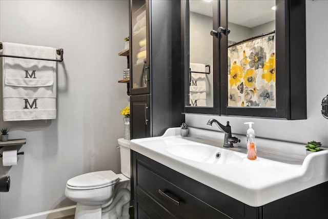 bathroom with vanity and toilet