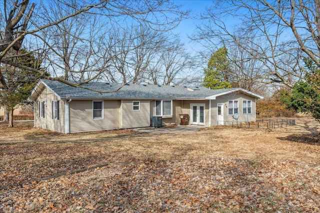 rear view of property featuring cooling unit